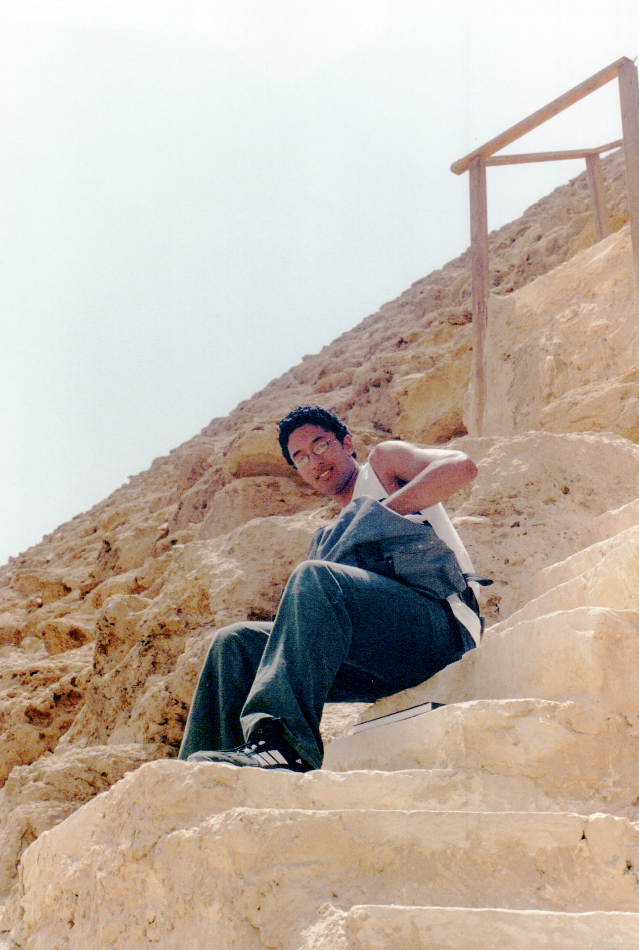 Resting on the steps of a pyramid