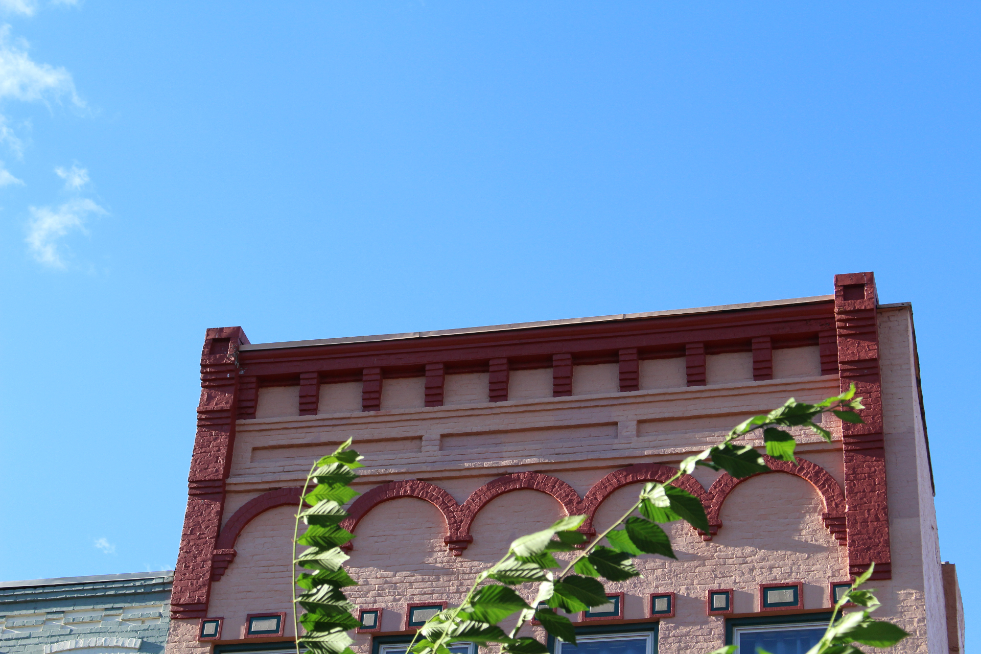 Brick & Glass — arched parapet