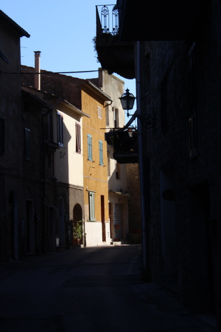 Roman Light — ochre house at the end of the street