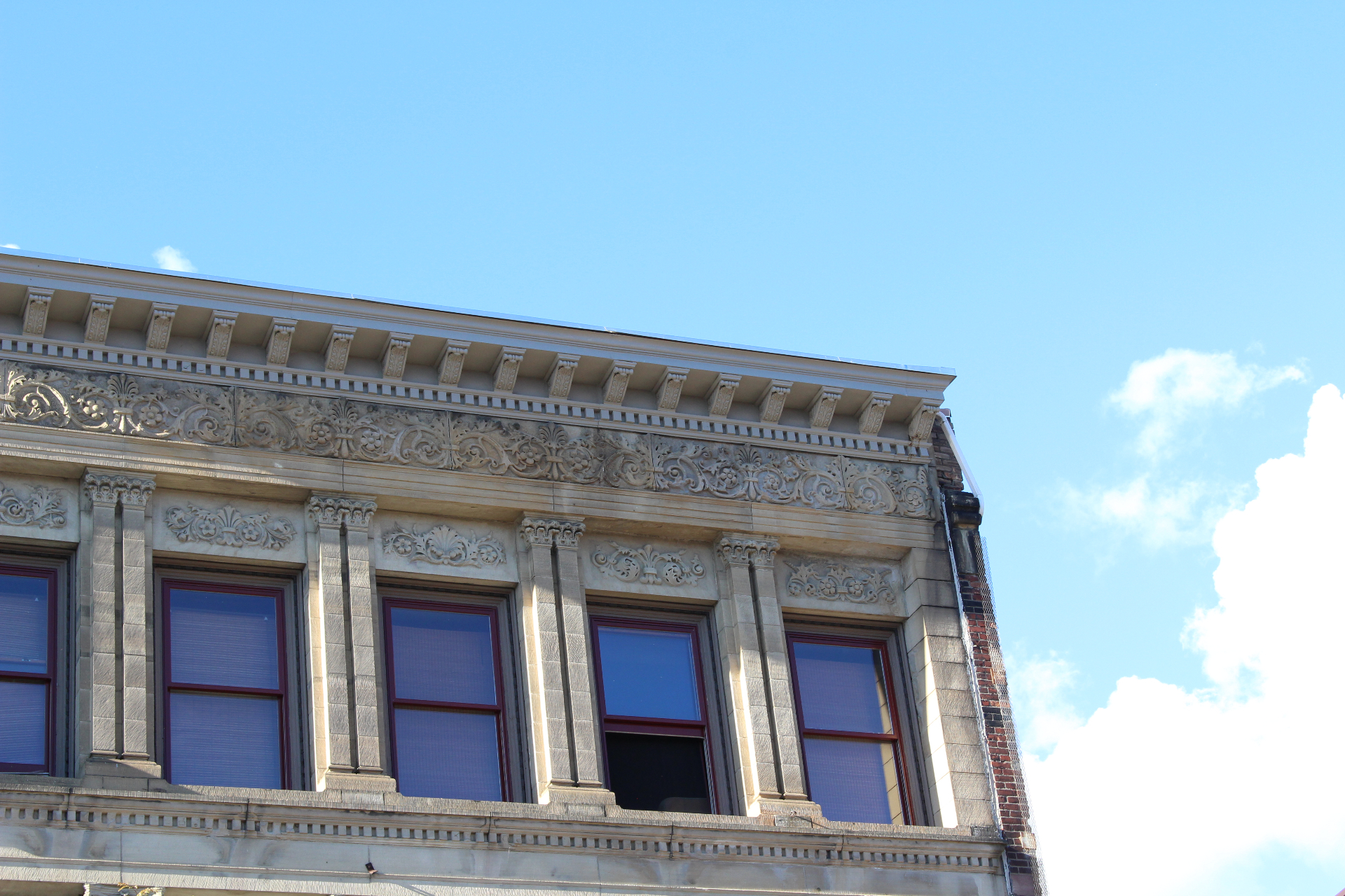 Brick & Glass — carved stone frieze